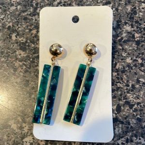 Green and gold colored earrings